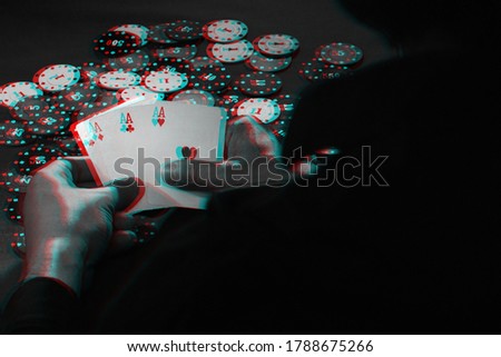 men's hands hold cards , a set of aces on the background of playing chips. Black and white with 3D glitch virtual reality effect