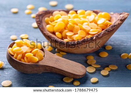 Beeswax pellets in the spoon Royalty-Free Stock Photo #1788679475