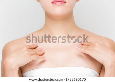 A woman is touching her clavicle. Royalty-Free Stock Photo #1788690170
