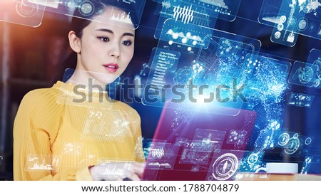 Communication network concept. Young asian woman in the office. GUI (Graphical User Interface). Royalty-Free Stock Photo #1788704879