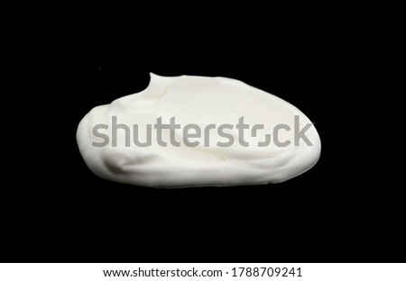 White whipped cream isolated on black background. Meringue on black. Royalty-Free Stock Photo #1788709241