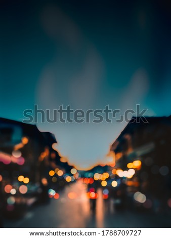 Blurred picture of people walking at night market in Thailand.