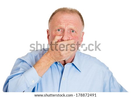 Closeup portrait of senior mature man closing mouth with hand, shocked, disgusted by what someone said or what he saw, isolated on white background. Negative emotion facial expression feelings.