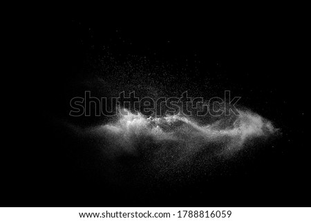 White talcume powder explosion on black background. White dust particles splash. Royalty-Free Stock Photo #1788816059