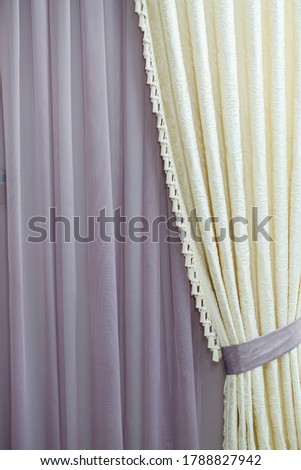 Close up of a curtain. part of the drapery by the window. Tulle for windows