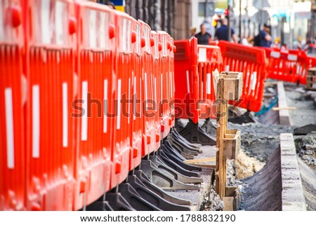 Road construction works in the city street. A road construction hinders traffic in a city. Selective focus