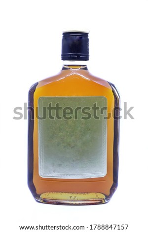 Small​ bottle​ of​ alcoholic beverage.Brandy​ or​ liquid​ isolated​ on​ white​ background.