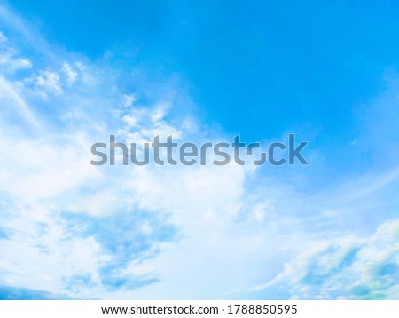 Beautiful blue sky and white clouds of various shapes with sunlight. Nature background Royalty-Free Stock Photo #1788850595