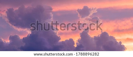 Sunset / sunrise with dramatic cloudscape, vivd colors in panoramic format Royalty-Free Stock Photo #1788896282