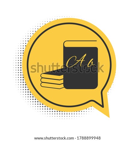 Black ABC book icon isolated on white background. Dictionary book sign. Alphabet book icon. Yellow speech bubble symbol. Vector.