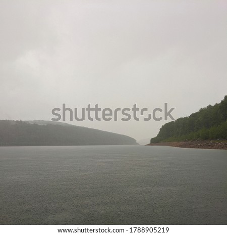 A rainy day on a lake in the Northwestern Appalachian mountains. 
