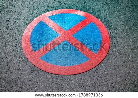 No stopping sign on rough asphalt in Detail