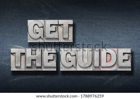 get the guide phrase made from metallic letterpress on dark jeans background