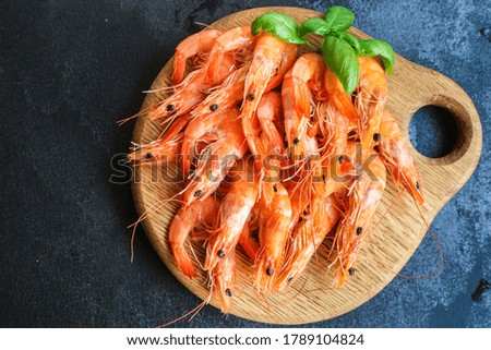 shrimps cooked seafood ready to eat prawn serving size snack. food background top view copy space healthy eating raw pescetarian 