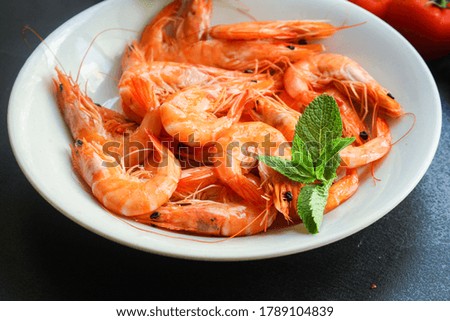 shrimps cooked seafood ready to eat prawn serving size snack. food background top view copy space healthy eating raw pescetarian 