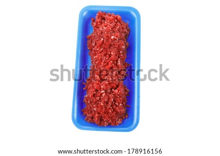 fresh raw mince beef meat on blue tray isolated over white background