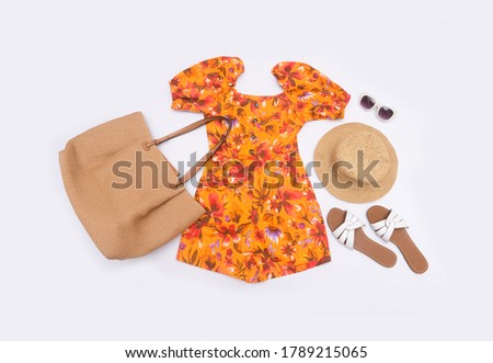 Fashion woman long floral pattern dress with handbag, sunglasses and handbag ,straw hat ,shoes on white background
