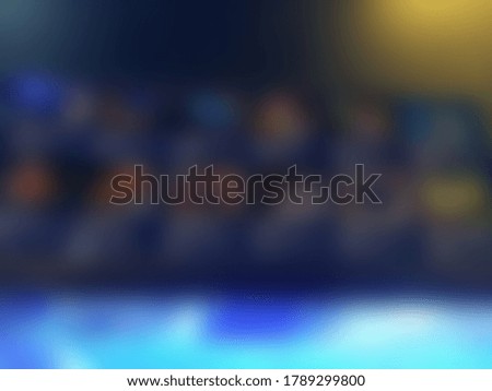 Blurred abstract photo of fishes in a blue aquarium