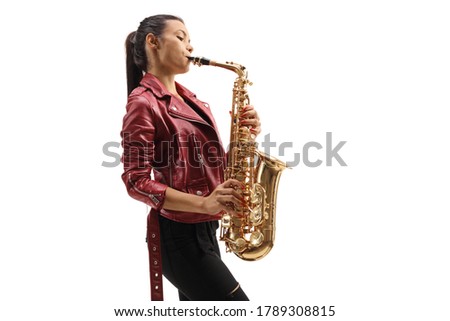 Full length profile shot of a female saxophonist performing isolated on white background Royalty-Free Stock Photo #1789308815
