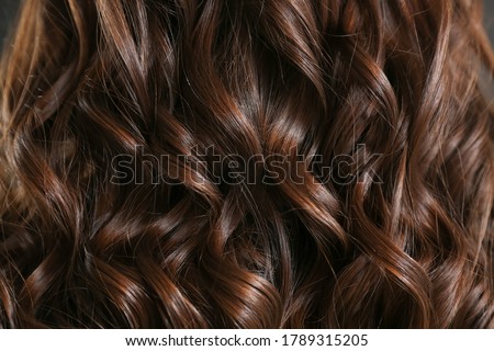 Healthy curly female hair, closeup Royalty-Free Stock Photo #1789315205