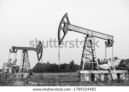 Oil pump. The equipment for oil production. Black and white photo