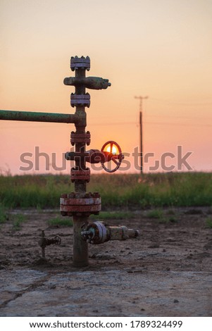Oil pump valve at sunset