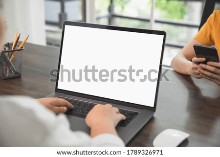 Woman hand using laptop and type on the keyboard. Mockup screen of advertisement.