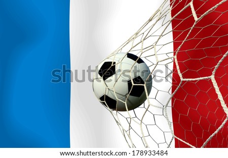 The symbolic power of success and victory. Classic soccer ball (football) has black and white color going into the in-goal net score after shot in the game. Concept success France soccer ball