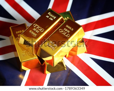 1,000 grams of gold bars, placed on the ground of the United Kingdom flag.  