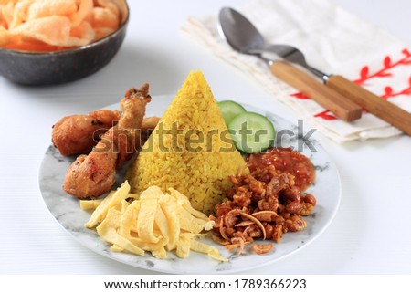 Nasi Tumpeng Agustusan is Dome Shape Yellow Rice with Various Side Dish to Celebrate Indonesian Independence Day Royalty-Free Stock Photo #1789366223
