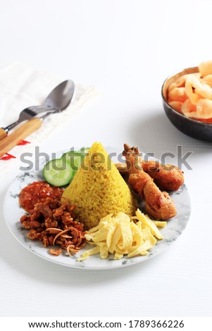 Nasi Tumpeng Agustusan is Dome Shape Yellow Rice with Various Side Dish to Celebrate Indonesian Independence Day Royalty-Free Stock Photo #1789366226