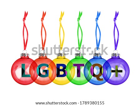 Christmas decoration hanging glass balls LGBTQ community rainbow flag color white background isolated closeup, LGBTQ+ letters, LGBT pride symbol, festive design, gay, lesbian etc New Year holiday sign
