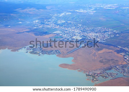 Aerial view of Neusiedl am See town in Austria . Flying over the Lake Neusiedl . Scenic lake in Austria Neusiedler See