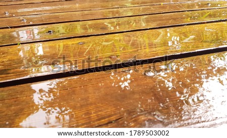 Fragment of a wet wooden road. High quality photo