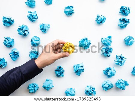 Idea and creativity concepts with person choosing outstanding paper crumpled ball in mountain shap.Think out of box.Business solution. Royalty-Free Stock Photo #1789525493