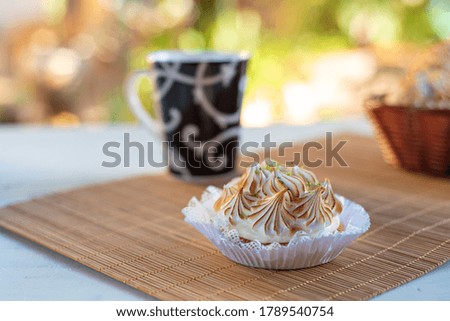 lemon pie and accessories with blurred background, natural light on white table, selective focus