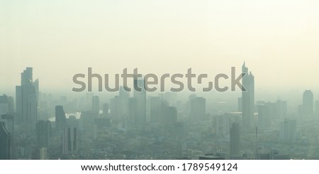 Concept of Pollution PM2.5 Unhealthy air pollution dust. Toxic haze in the city. Photos in the capital on a skyscraper. Royalty-Free Stock Photo #1789549124