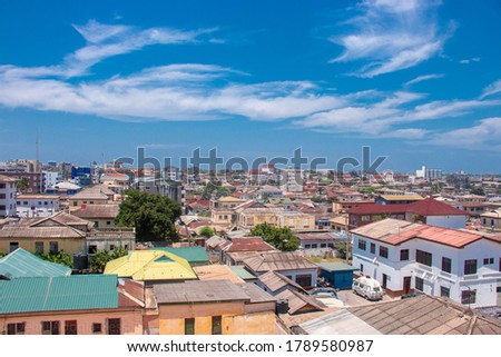 Parts of urban Accra under a blue skyline. Accra housing.