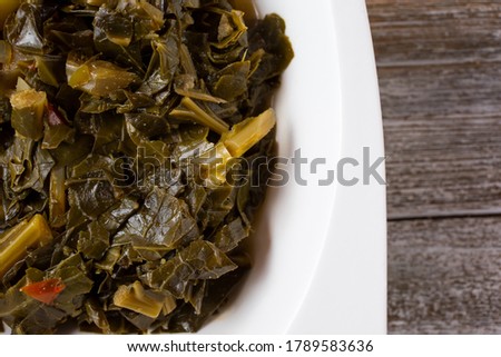 A top down view of a bowl of collard greens.