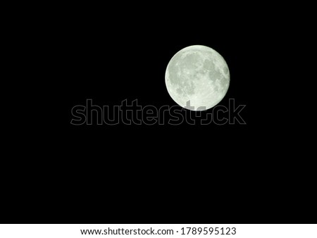White moon with black background photo