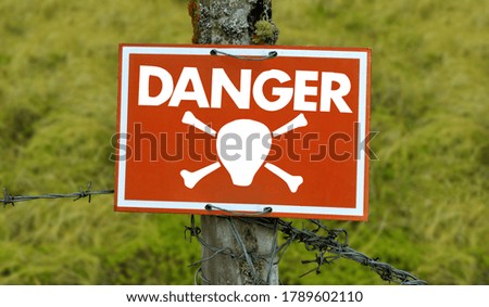 Danger Sign on the red signboard