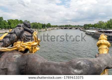 View from the Pont Alexandre Bridge. The bridge is a neo-baroque arch bridge over the Seine in Paris.