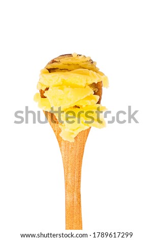 Wooden spoon with ghee or clarified butter isolated on white background Royalty-Free Stock Photo #1789617299