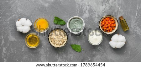 Natural ingredients for homemade cosmetic masks on a gray concrete background, banner. The concept of beauty and rejuvenation. Top view, flat lay, copy space