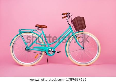 Photo of woman retro vintage bicycle used for town transportation with brown basked isolated over pink color background Royalty-Free Stock Photo #1789689686