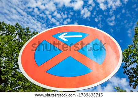 no stopping sign under clear blue sky