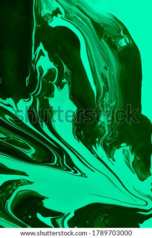 Monochrome malachite marble background.Mixed nail polishes,make up concept.Beautiful stains of liquid nail laquers.Fluid art,pour painting technique.Vertical banner.