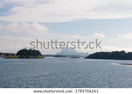 Bronnoysund, Norway - 04. Aug, 2020: Bronnoysund coastline with its traditional houses and waterfronts,  helgelands coastline, norwegian coastline, raditional norwegian city