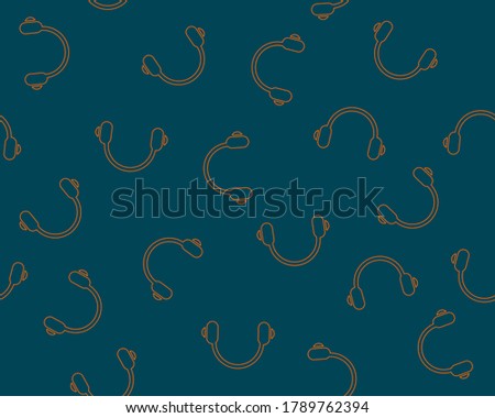 Vector illustration of a seamless pattern with headphones on a dark background.