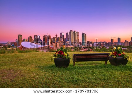 A colorful sunrise sky over downtown Calgary in the summer Royalty-Free Stock Photo #1789781906